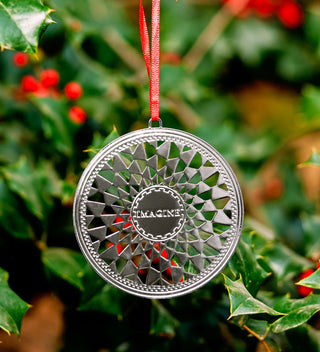 Elegant silver ornament inspired by the John Lennon 'Imagine' mosaic in Central Park's Strawberry Fields. All products available through Central Park Conservancy Shop.