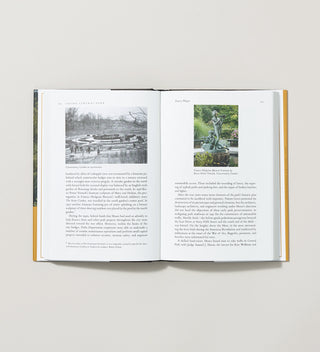 An open book with images of Conservatory Garden in Central Park and text