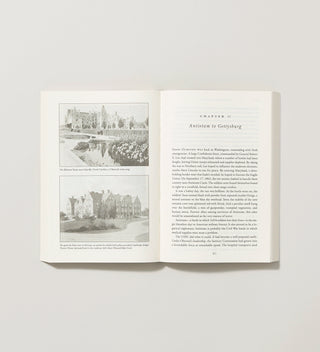 an open book with  text and black and white illustrations of landscapes designed by Frederick Law Olmstead