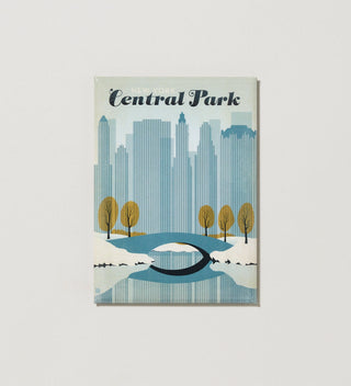 Central Park Travel magnet with a winter scene and New York City skyline