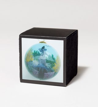 Decorative ornament with a painting of a fountain with a female angel figure in a box