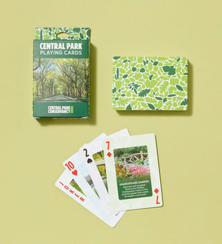 Central Park playing cards pack and several cards laid out, showcasing images of various park locations.