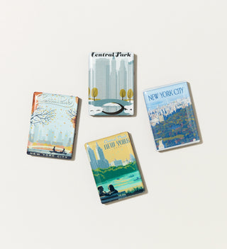 a set of four magnets featuring seasonal vignettes of Central  Park in the style of vintage Travel Posters