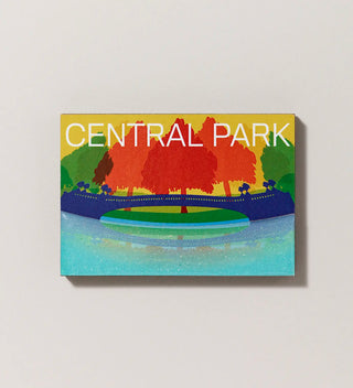 a magnet featuring an illustration  of Bow Bridge from the the view point of the surface of the Lake in Central Park in blues greens yellow and oranges 