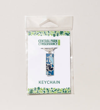 Central Park Conservancy keychain with blue leaf design pendant in packaging