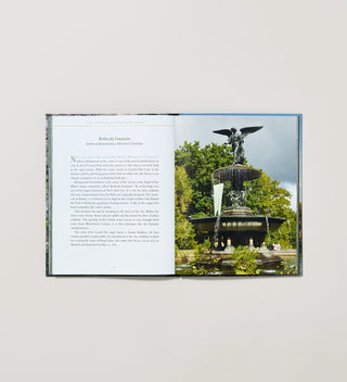 an open spread of a book with a photograph and description of Central Park's Bethesda Fountain 