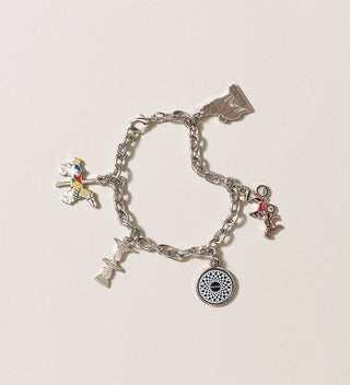 Central Park Conservancy charm bracelet out of its packaging, showing various charms including a carousel horse, Balto, and more