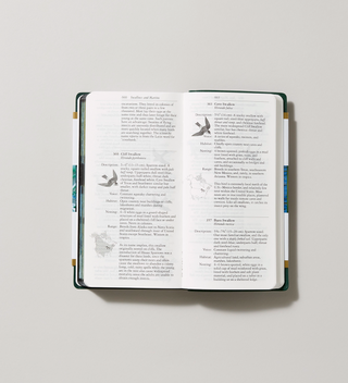 Opened Field Guide to Birds with written descriptions of birds