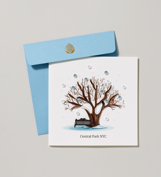 Square handmade card with decoration of snow falling on a tree and bench with the text Central Park  NYC