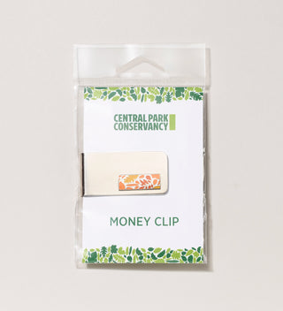 Central Park Conservancy money clip with orange leaf design pendant in packaging