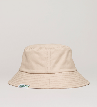 Back view of beige "Central Park New York" bucket hat, with a tag with the Central Park Conservancy logo