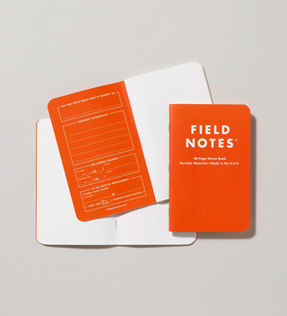 Three waterproof and tearproof notes notebooks, one closed, one open to a blank page, and one open to show the inside cover