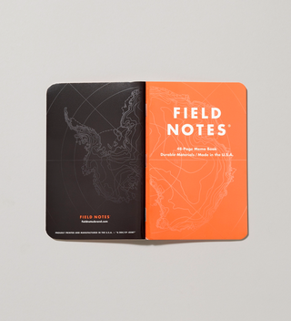 Opened field notes notebook with a map spread across the front and back covers