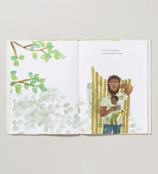 an open book with a watercolor illustration of a tree branch and a man laying on a bench with a baby resting on his chest