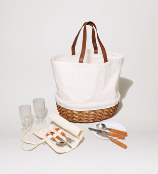 White picnic bag, shown alongside cutlery, plates, and glasses