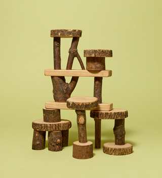 Barked wooden blocks set up in a tower