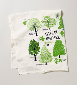 Opened flour sack tea towel with illustrations of several New York trees