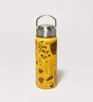 a golden yellow water bottle with a metal handle and illustrations of honey bees and botanicals