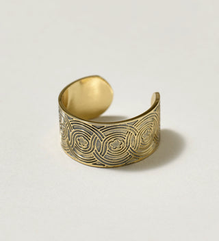 Close-up of small Central Park Conservancy ring with intricate circular patterns and floral motifs