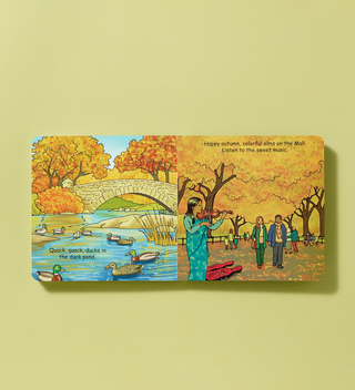 Illustrated book spread showing ducks in the duck pond and people enjoying music under colorful elm trees in Central Park during autumn.