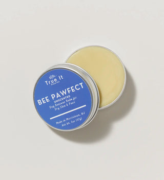 open round tin of beeswax paw balm with blue label and white text 