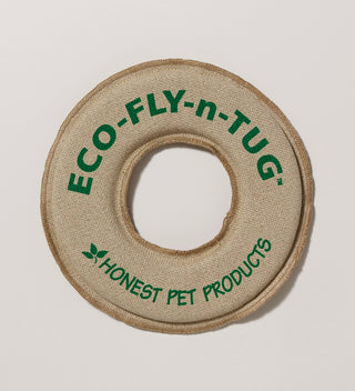 a Hemp fabric donut-shaped dog toy with the text Eco-Fly-n-Tug printed in green