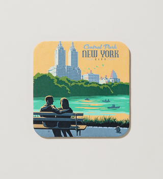 Central Park-themed coaster featuring a couple sitting on a bench by the lake with the city skyline in the background.