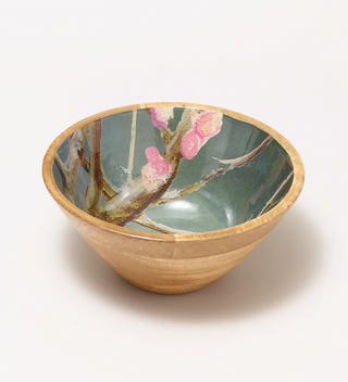 Wooden bowl with a painted flower and branch pattern on the inside