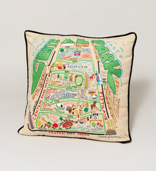 a richly embroidered cream pillow with a black edging features an multi-colored and abstracted map of Central Park