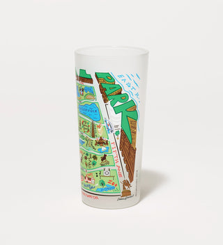 Frosted drinking glass with a vibrant map illustration of Central Park, showing landmarks along Fifth Avenue.