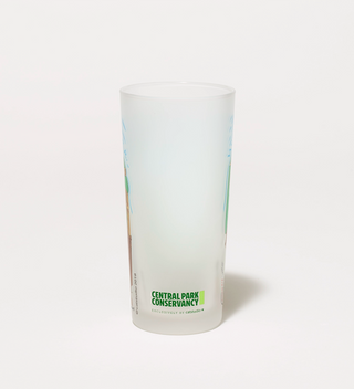 Frosted drinking glass with a Central Park Conservancy logo on the back.