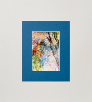 Art print in a blue frame, featuring a bird, a tree branch, and splashes of color throughout