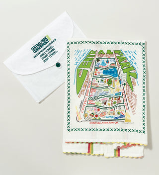 An embroidered tea towel featuring a folk inspired aerial view of Central Park and an embroidered envelope  package