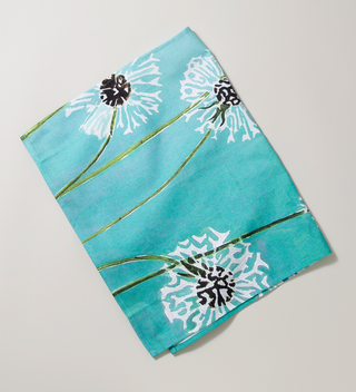 Teal cloth tea towel with white dandelion print
