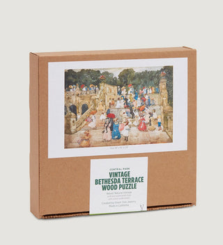 a carboard box with an image of a painting of Bethesda Terrace and a sticker that says Vintage Bethesda Terrace Wood Puzzle