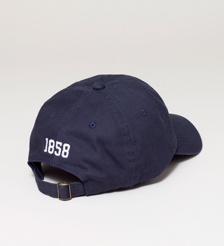 Back view of a navy blue baseball cap with white embroidered text '1858' and an adjustable strap.