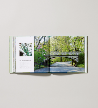 Inside spread of Hardcover book titled "Seeing Central Park: The Official Guide Updated and Expanded" by Sara Cedar Miller with pages displaying an image of the reservoir bridges