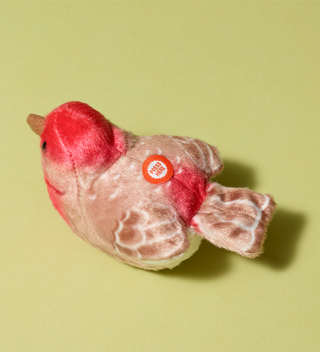 Audubon plush toy, House finch bird with red and beige colors, featuring a button labeled 'Press Here' on its back to hear an authentic bird call from the Cornell Lab of Ornithology's wildlife recordings