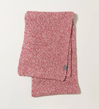 a folded red and white mélange knit scarf with a grey Central Park 1858 wrap tag  on a grey background