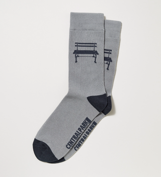 Gray and black Central Park Conservancy adult socks with a Central Park bench on them