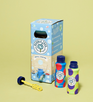 Bubbles in a box out of the packaging, with bottles of bubble solution, bubble wand, and refill station displayed