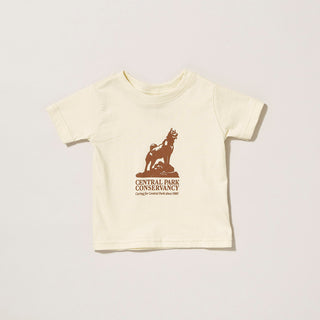 Light Beige cotton infant t-shirt with Central Park Conservancy Balto desing in a chestnut brown on a gray background