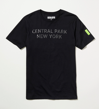 Black t-shirt with "Central Park New York" written on the front in black lettering and  green Park mark on the left sleeve