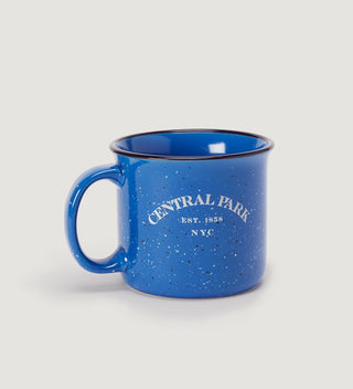 a blue mug with white text  reading  Central Park Est 1858, NYC on a grey background