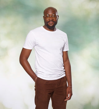 man wearing a white tshirt with CENTRAL PARK NEW YORK in dove grey on the front