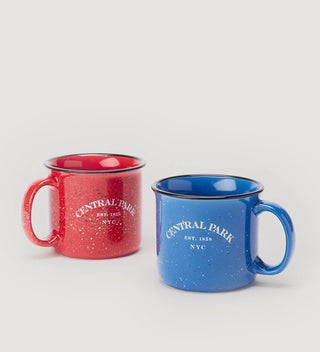 a red  and a blue mug with white text  reading Central Park Est 1858, NYC on a grey background