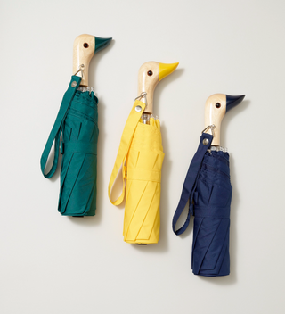 Three colorful umbrellas with the handles shaped to look like ducks