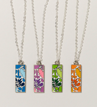 four necklaces with blue, pink, green and orange leaf and botanical designs