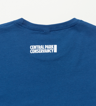 Back view of a blue t-shirt with "Central Park Conservancy" logo