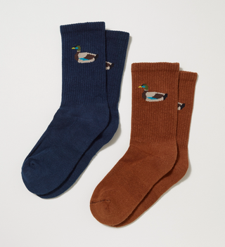 Two pairs of socks with a duck on them, one navy blue and one brown